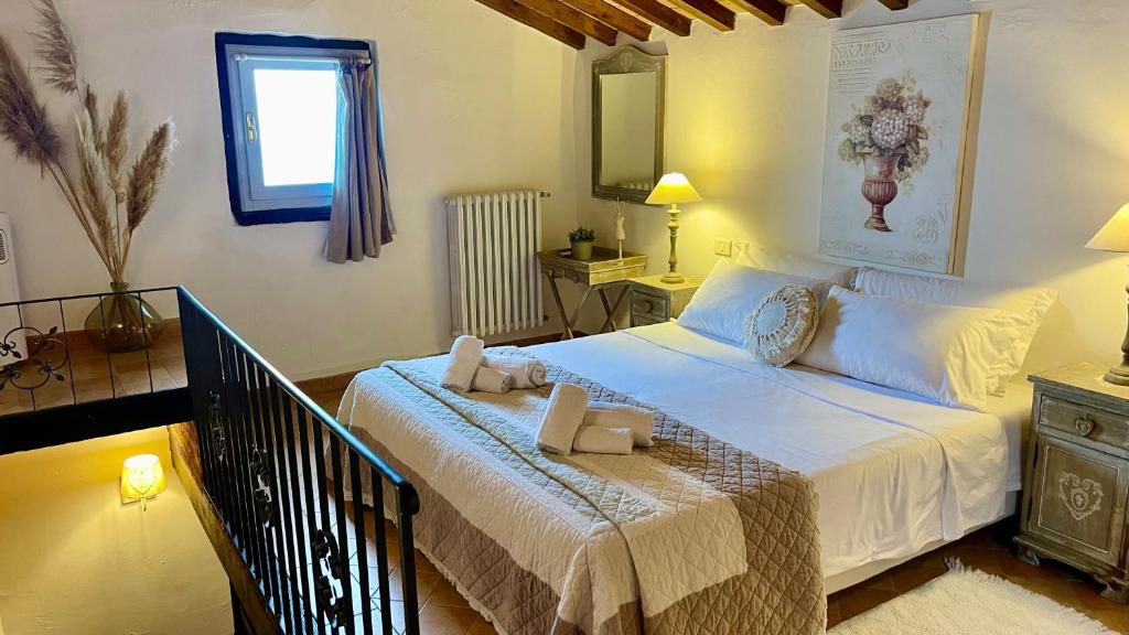 Postel nebo postele na pokoji v ubytování Relais Il Pozzeto