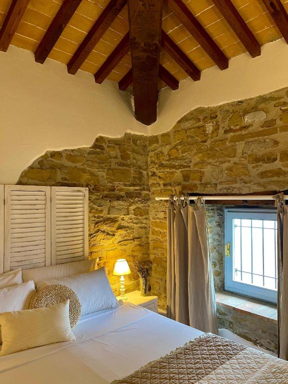 Postel nebo postele na pokoji v ubytování Relais Il Pozzeto