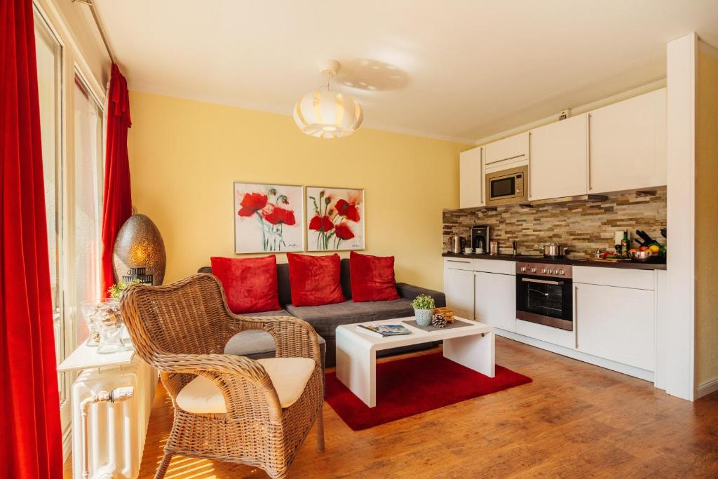 a living room with a couch and a table at Chalet Paulsbergwiese in Braunlage