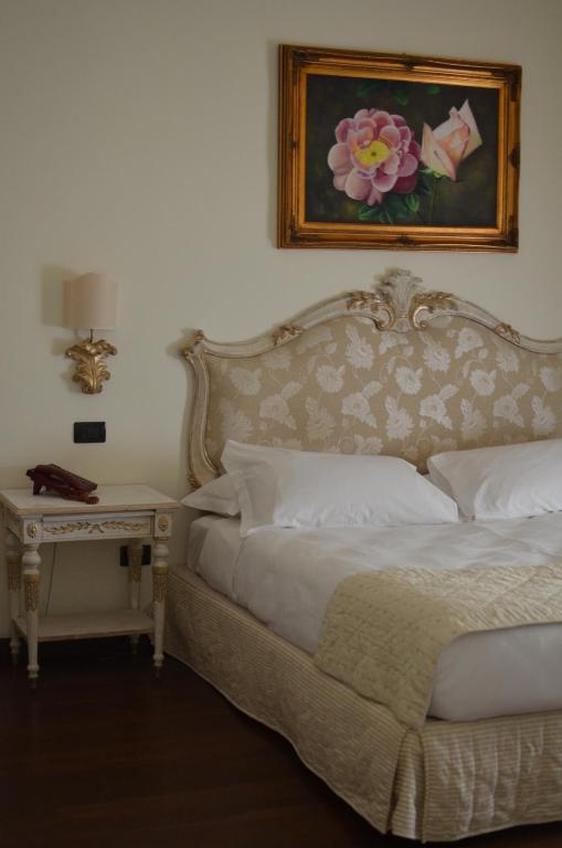Postel nebo postele na pokoji v ubytování Grand Hotel Di Lecce