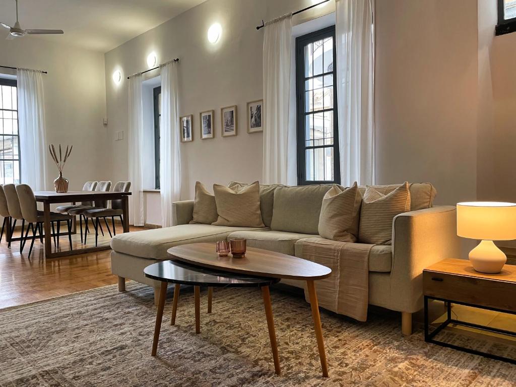 a living room with a couch and a table at Phaedrus Living: Cozy Down Town House Aischylou in Nicosia