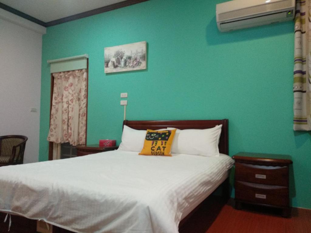 Postel nebo postele na pokoji v ubytování Ju Jia Xiao Zhan Homestay