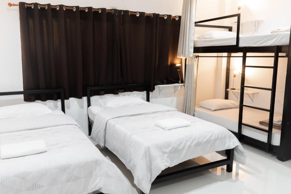 Postel nebo postele na pokoji v ubytování Munruk Hostel