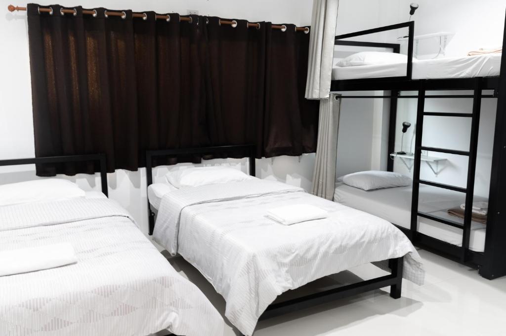 Postel nebo postele na pokoji v ubytování Munruk Hostel