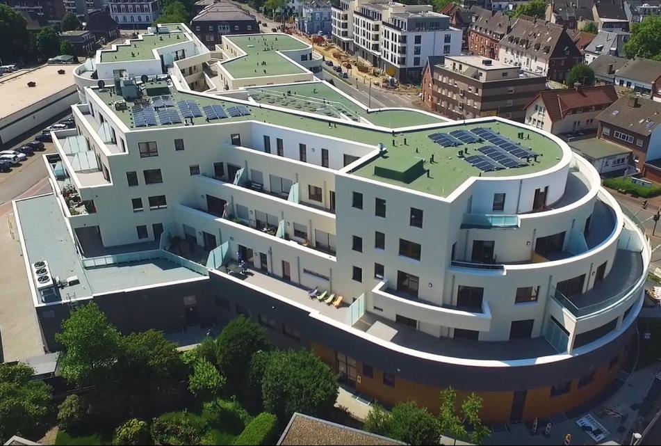 an image of a building with solar panels on it at Ostwall Terrassen Apartment 5.33 in Bocholt