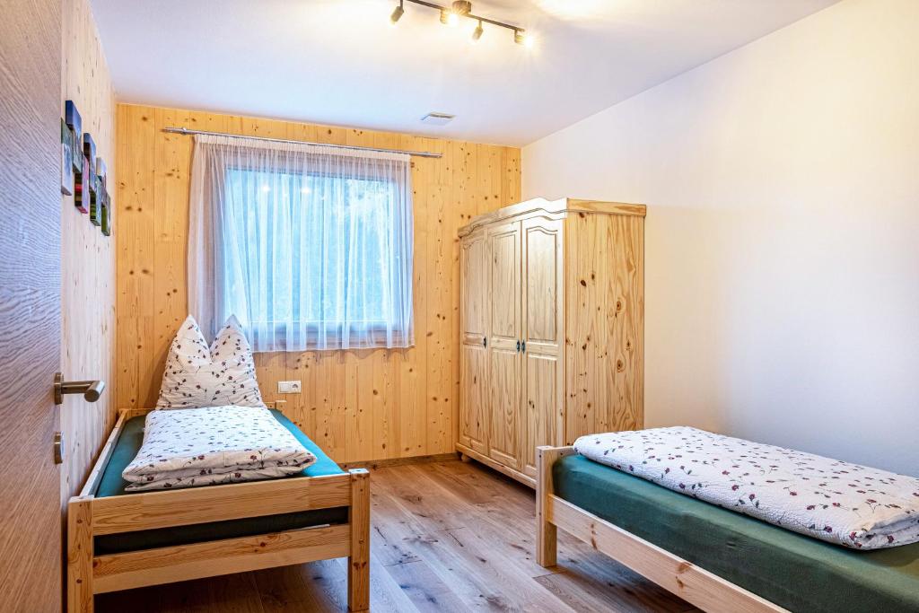 Postel nebo postele na pokoji v ubytování Mittnackerhof Apartment Kamille