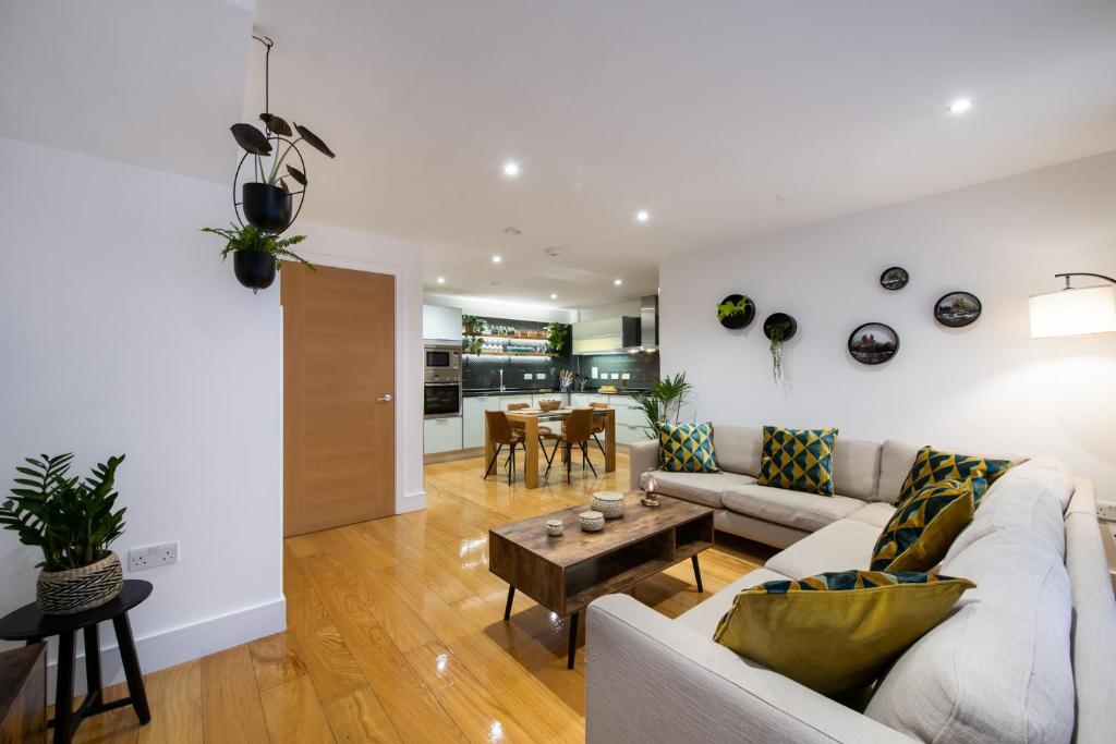 a living room with a couch and a table at London Nino Apartments in London