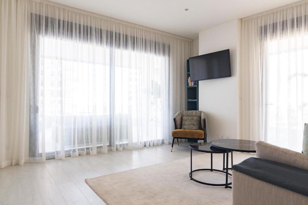 Televízia a/alebo spoločenská miestnosť v ubytovaní Apartamento Málaga Halia