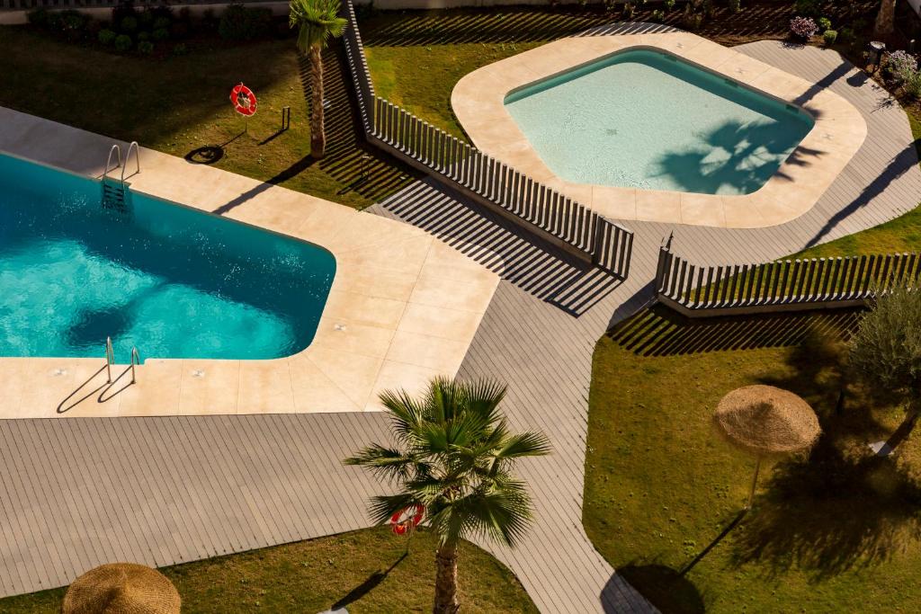 Bazén v ubytovaní Apartamento Málaga Halia alebo v jeho blízkosti