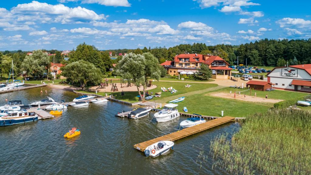 an aerial view of a marina with boats in the water at Hotel Ognisty Ptak in Węgorzewo