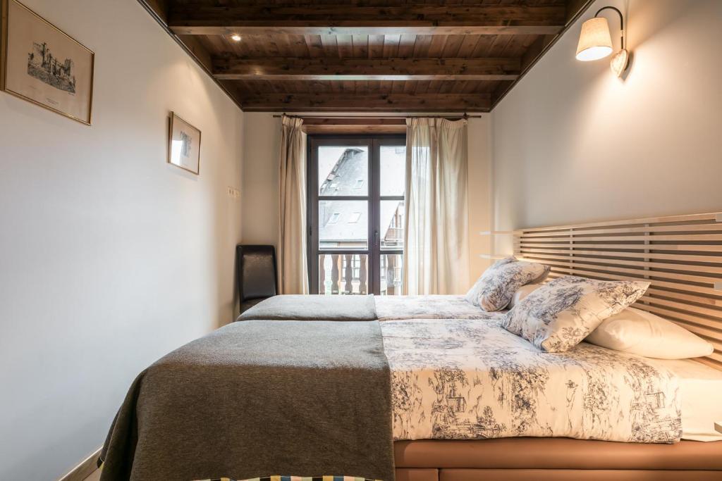A bed or beds in a room at Tulmas by Totiaran