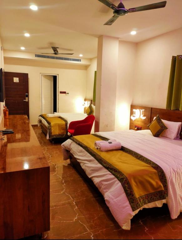 Postel nebo postele na pokoji v ubytování Namaste Benares Varanasi