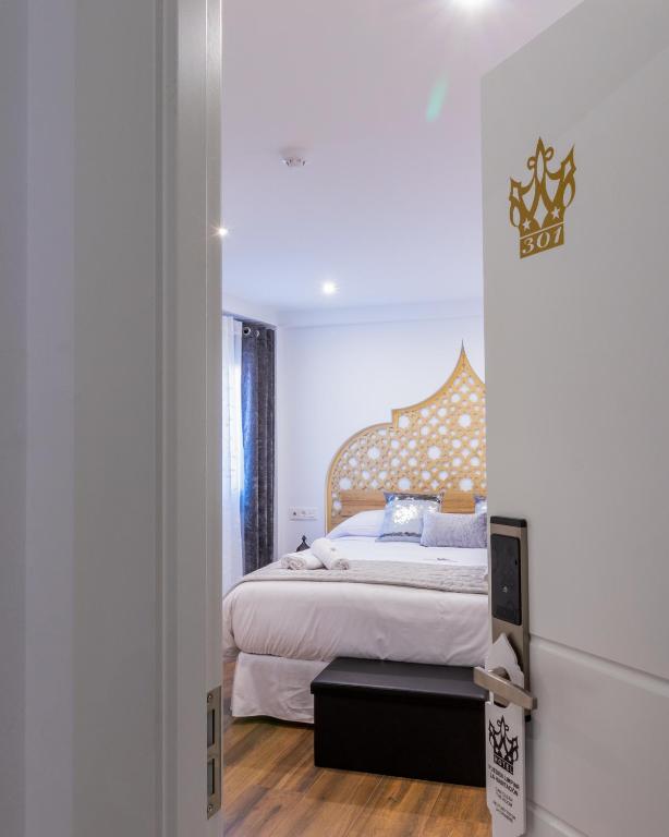 Postel nebo postele na pokoji v ubytování Hotel Reina Aixa