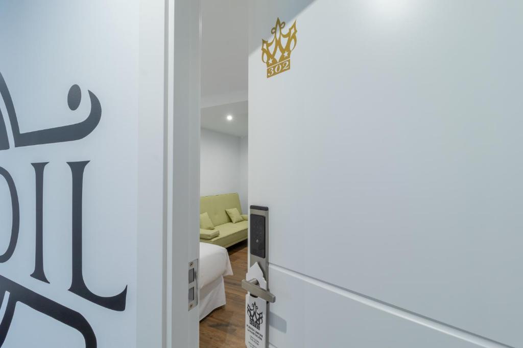 Postel nebo postele na pokoji v ubytování Hotel Reina Aixa