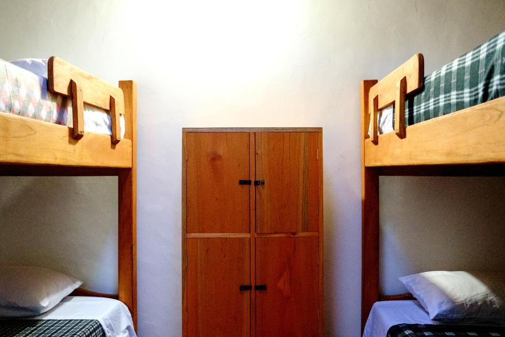 Postel nebo postele na pokoji v ubytování CAFE RACER HOSTEL
