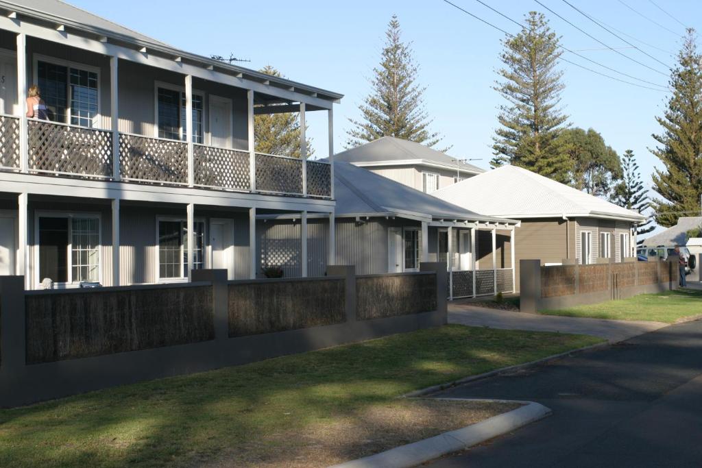 a house with a fence in front of it at Clearwater Motel Apartments in Esperance