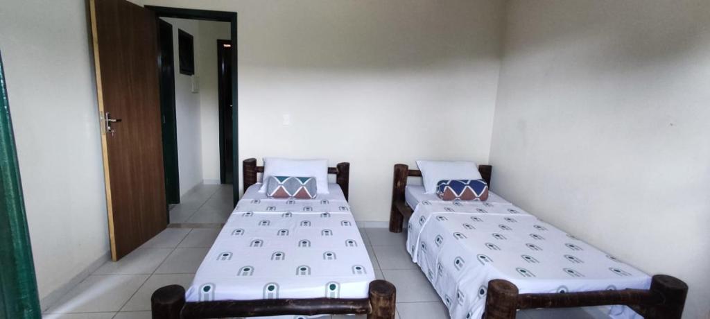 Postel nebo postele na pokoji v ubytování Casa do Renato Lençóis