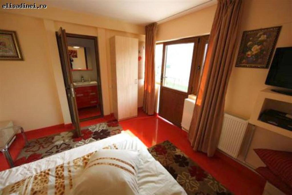 Postel nebo postele na pokoji v ubytování Complex Turistic Elisa