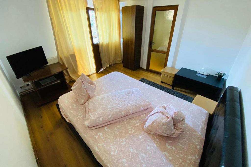 Postel nebo postele na pokoji v ubytování Complex Turistic Elisa