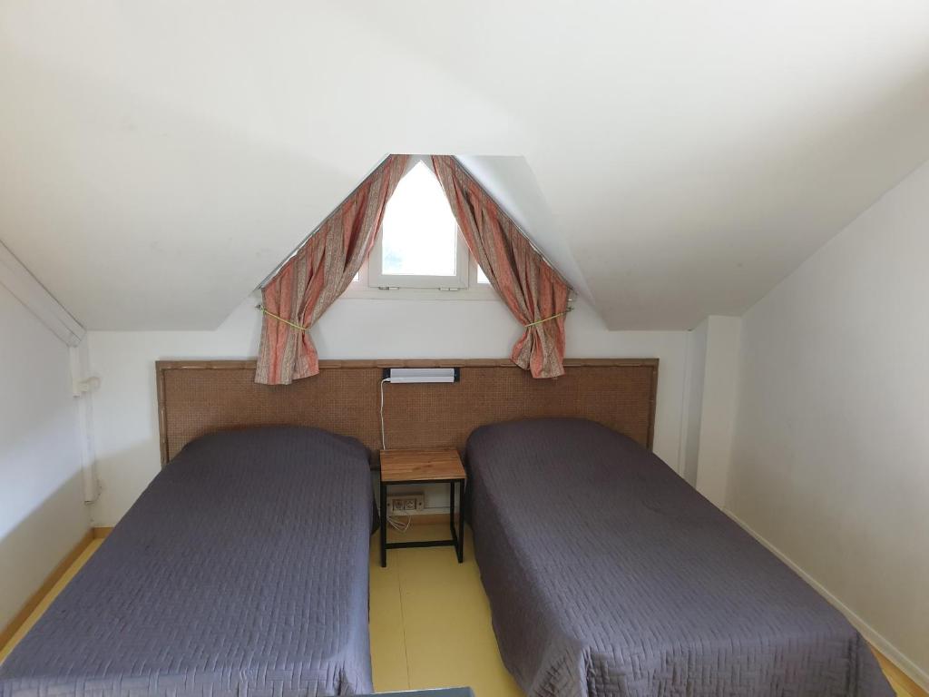 Postel nebo postele na pokoji v ubytování Aquabeach