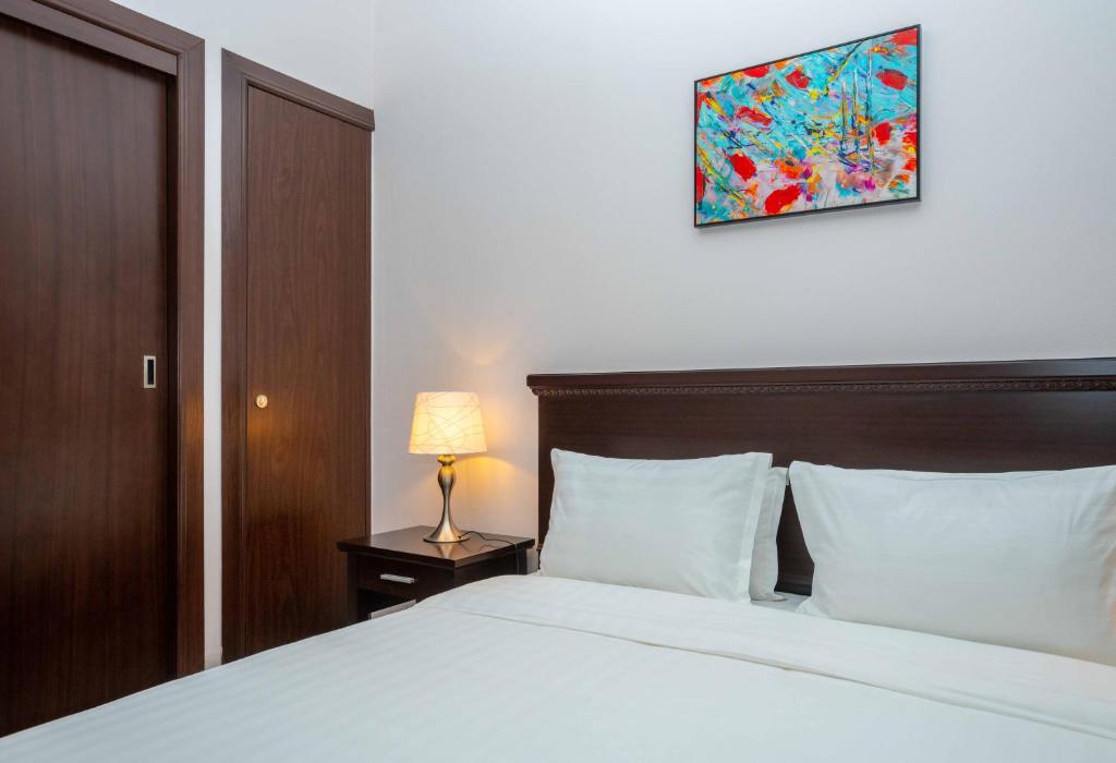Letto o letti in una camera di Ezdan Hotel, Residences
