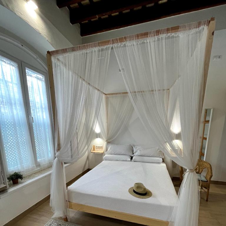 A bed or beds in a room at Apartamentos turísticos CASA de los BALCONES