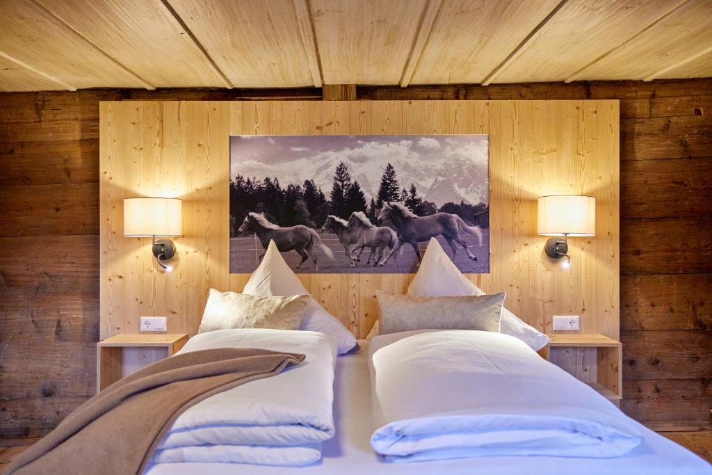 Postel nebo postele na pokoji v ubytování Haus Hoamat - Almrausch