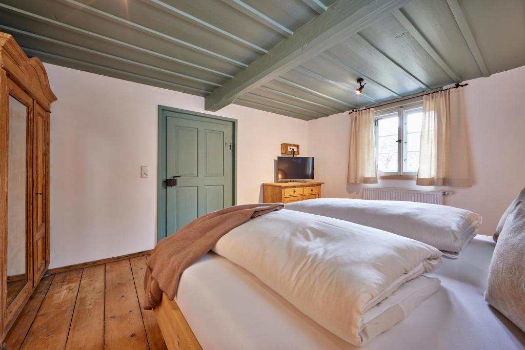 Postel nebo postele na pokoji v ubytování Haus Hoamat - Almrausch