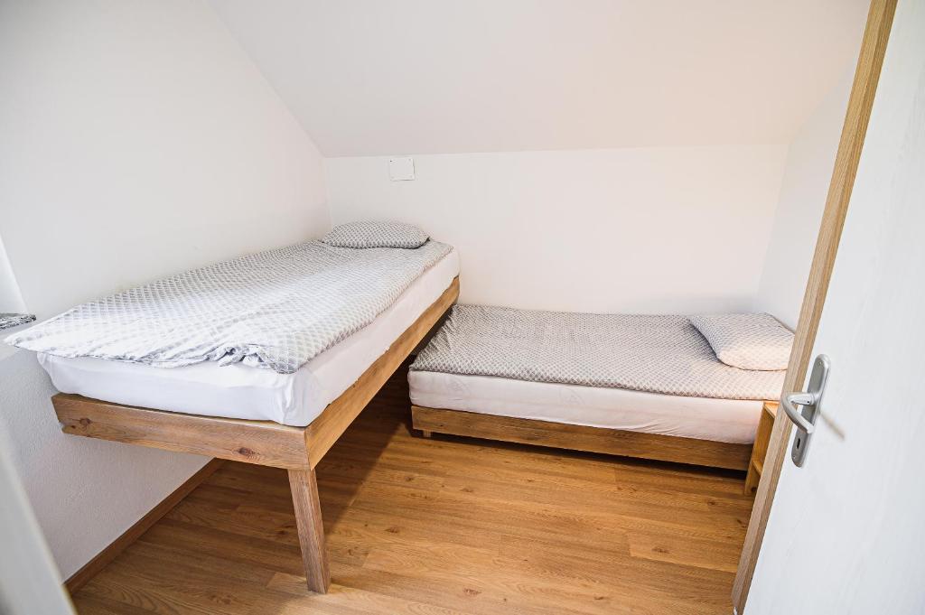 Postel nebo postele na pokoji v ubytování Mojčin Pisker Apartment House