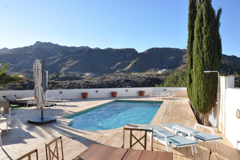 a swimming pool with a view of the mountains at Mojacar Apartment Near the Beach with Private Pool in Mojácar