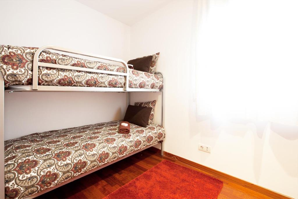 Posteľ alebo postele v izbe v ubytovaní Enjoy Apartments Maria II