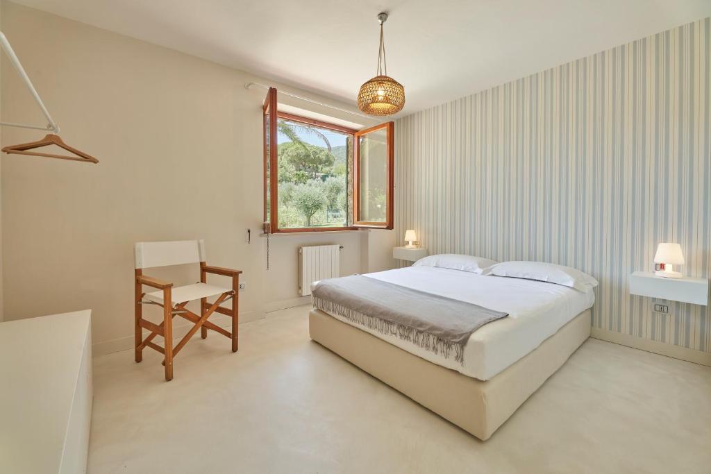 Postel nebo postele na pokoji v ubytování Villa Elle Exclusive Isola d'Elba