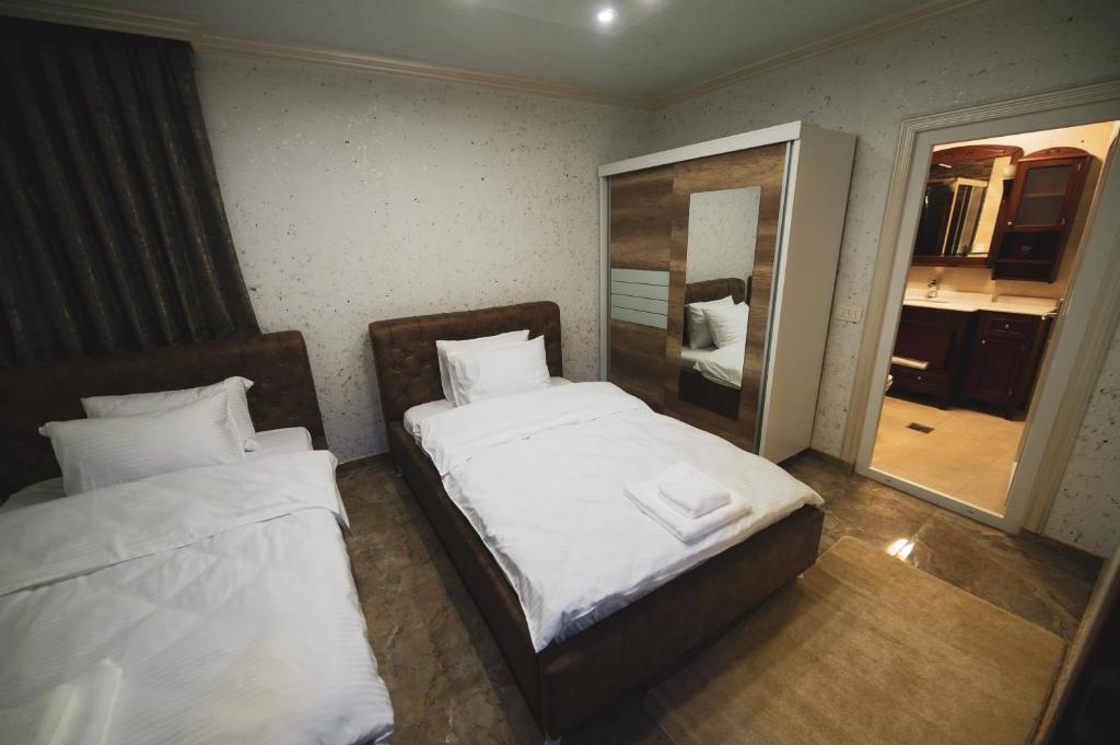 Postel nebo postele na pokoji v ubytování Hotel Premium