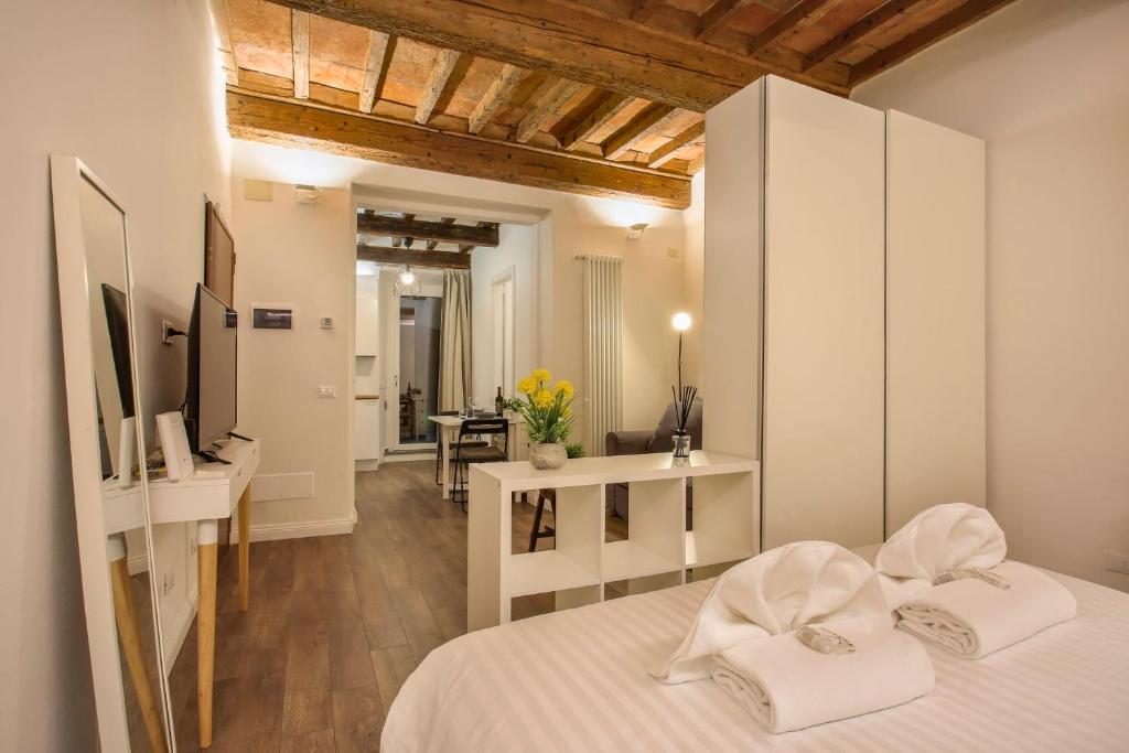 Posteľ alebo postele v izbe v ubytovaní Oltrarno Suite in Florence