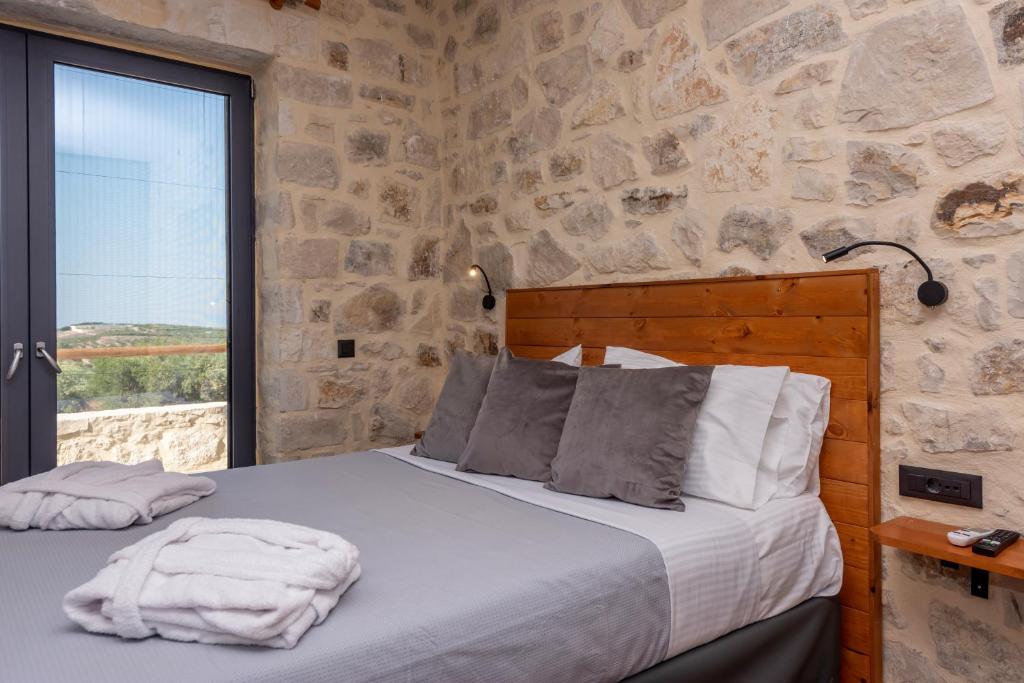 A bed or beds in a room at Alagni Cretan Resort