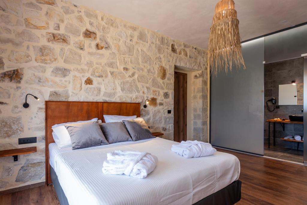 A bed or beds in a room at Alagni Cretan Resort