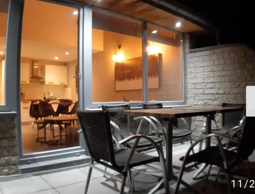 a dining room with a table and some chairs at Terrasses de Malmedy Lodge 417 in Malmedy