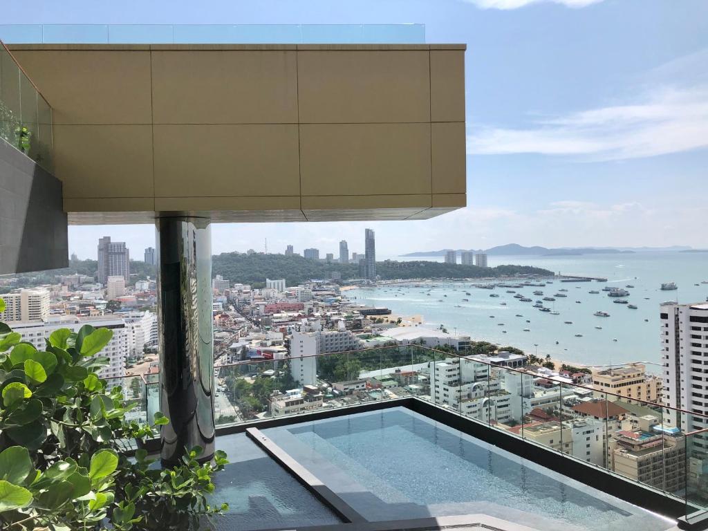 a view of the ocean from a building with a swimming pool at Edge Central Pattaya By Alice in Pattaya