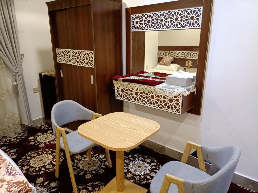 Postel nebo postele na pokoji v ubytování فندق ظاظا