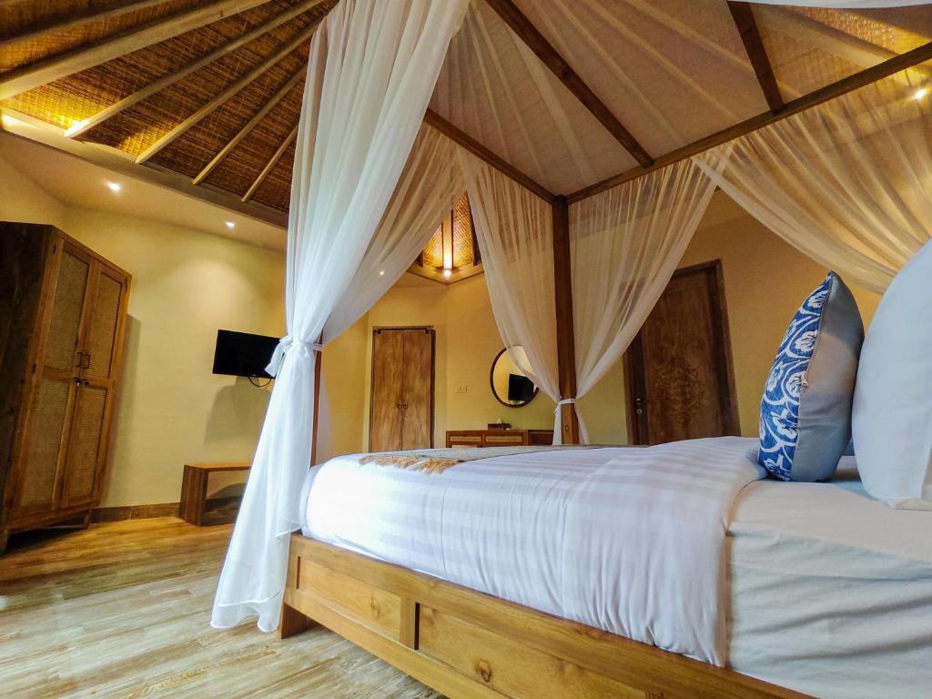 Postel nebo postele na pokoji v ubytování Seminyak Square Hotel And Villas