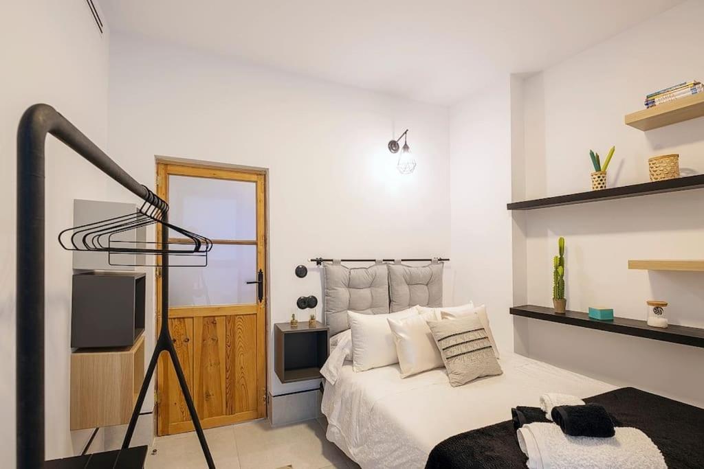 Łóżko lub łóżka w pokoju w obiekcie Piso-Loft COS Jaén Centro