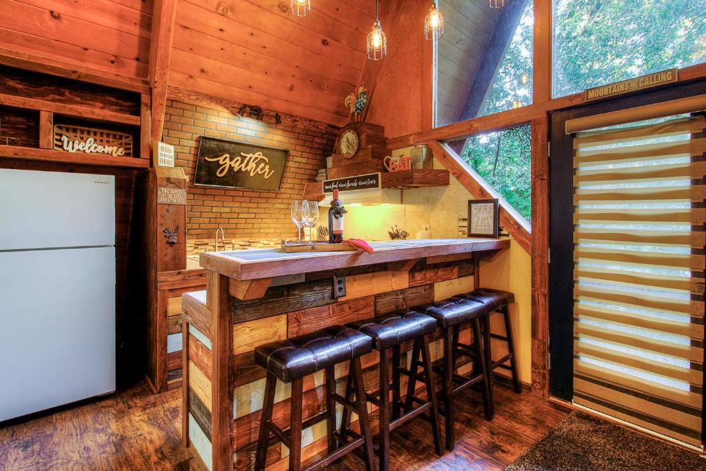a kitchen with a counter and a sink in a cabin at Redwoods River Resort & Campground in Leggett