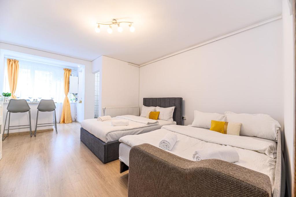 a large room with two beds and a couch at JAD - Family Studio - Soarelui 8 in Braşov