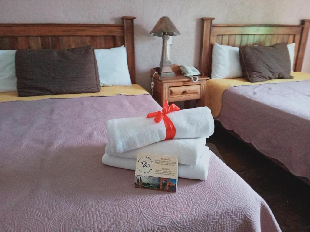 Postel nebo postele na pokoji v ubytování Hotel Refugio Victoria