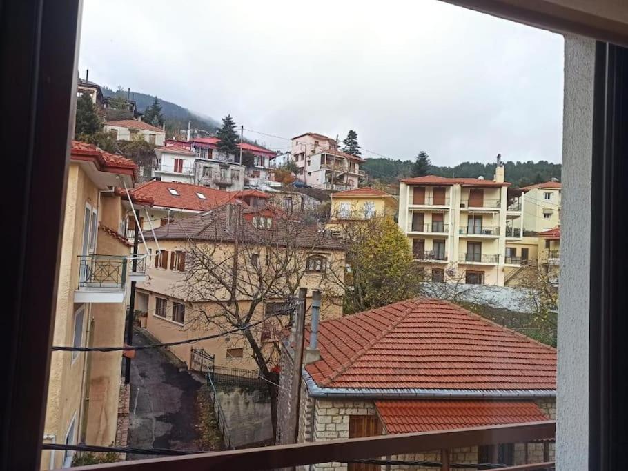 a view from a window of a city with buildings at Urban Mountain House in Karpenision