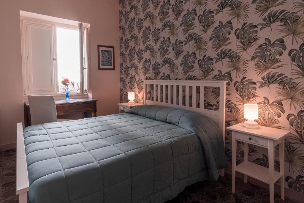 Postel nebo postele na pokoji v ubytování B&B Cumpari Turiddu