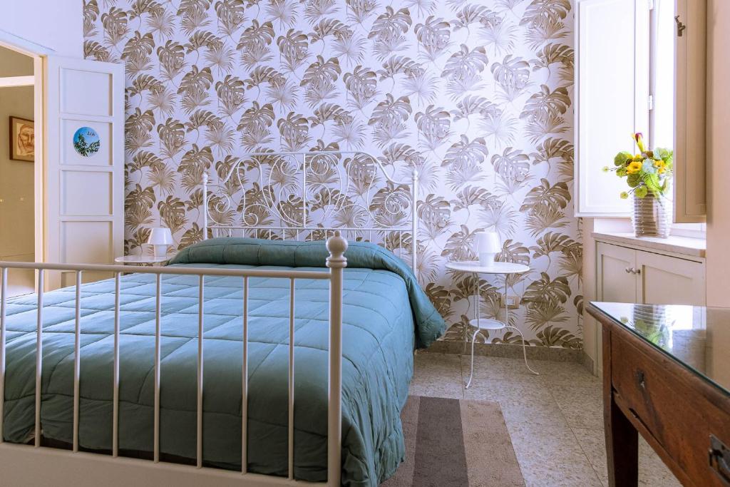 Postel nebo postele na pokoji v ubytování B&B Cumpari Turiddu