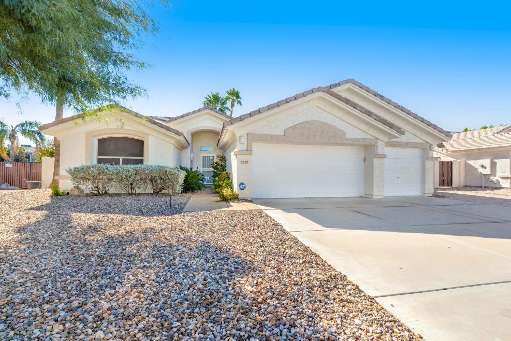 a house with a driveway and a garage at Paradise in the Valley in Phoenix