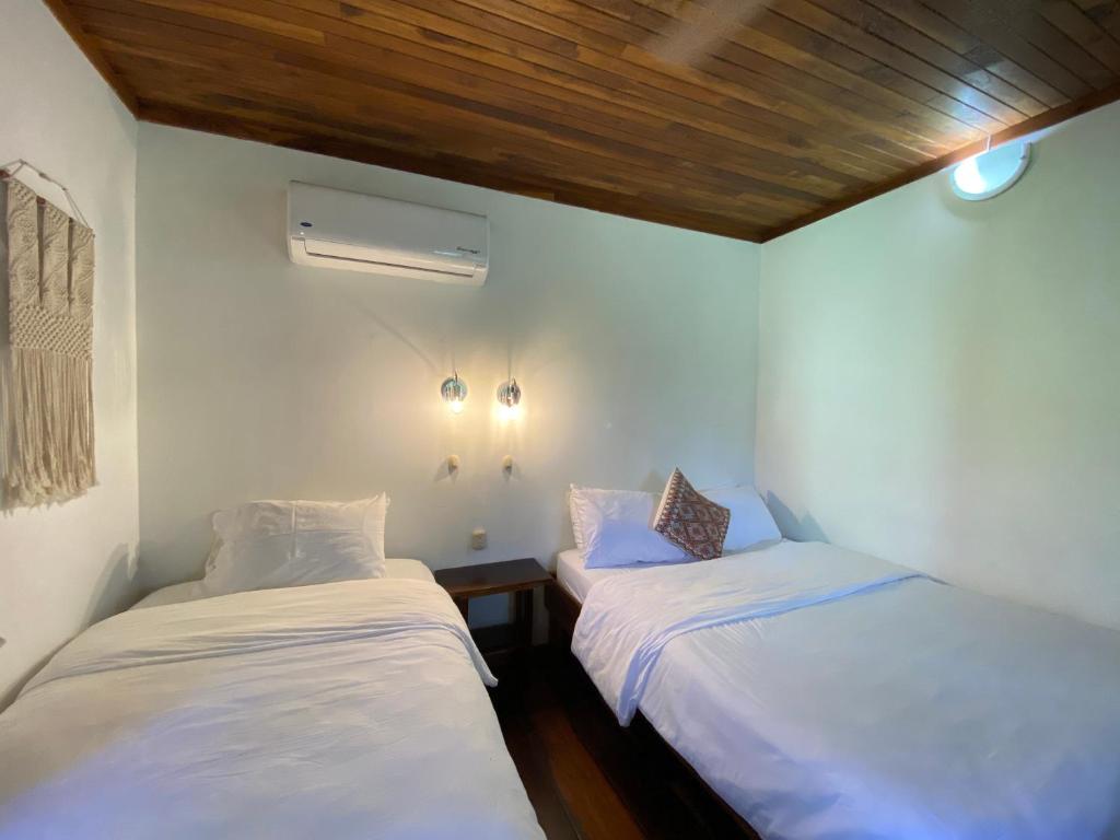 Postel nebo postele na pokoji v ubytování Casa Colores