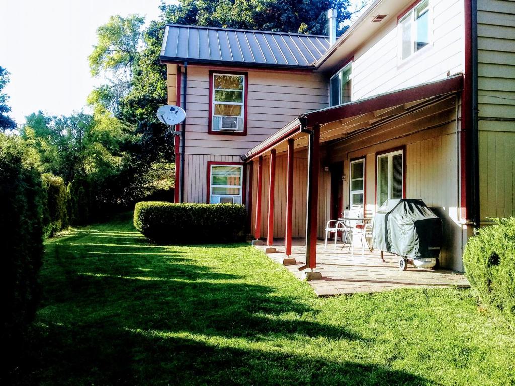 a house with a yard next to a house at Downtown White Salmon Garden Home in White Salmon